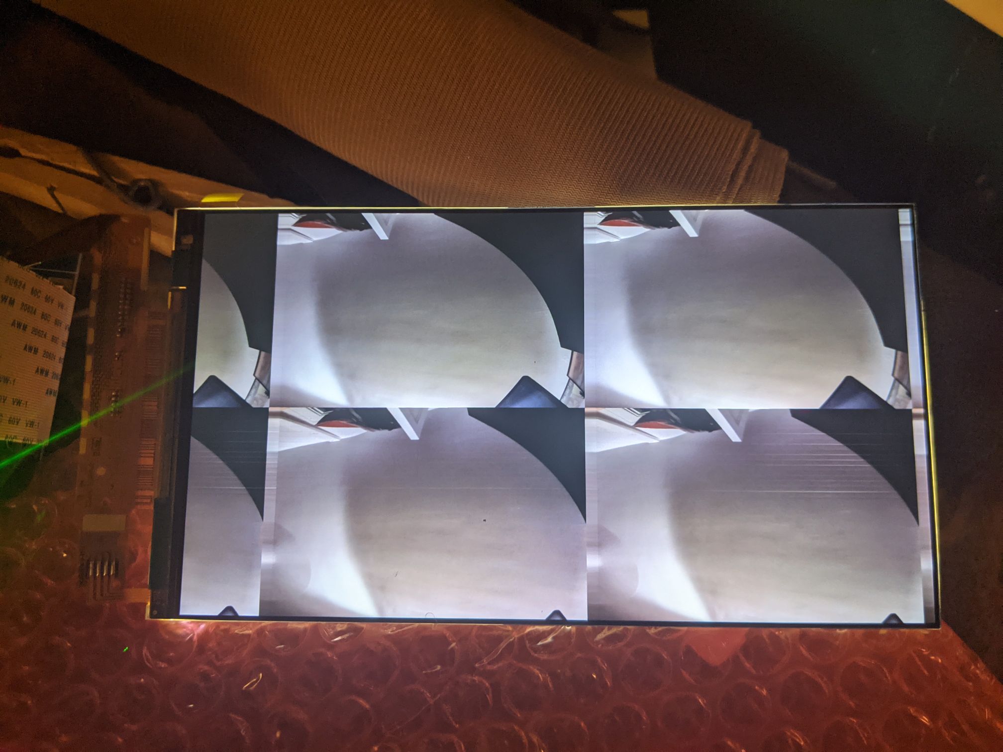 photo of screen showing video stream from pi: A thin sliver of the stream is shown atop two copies of the stream, then another sliver of the stream. The horizontal rectangles of the stream are stacked along the long axis of the screen.